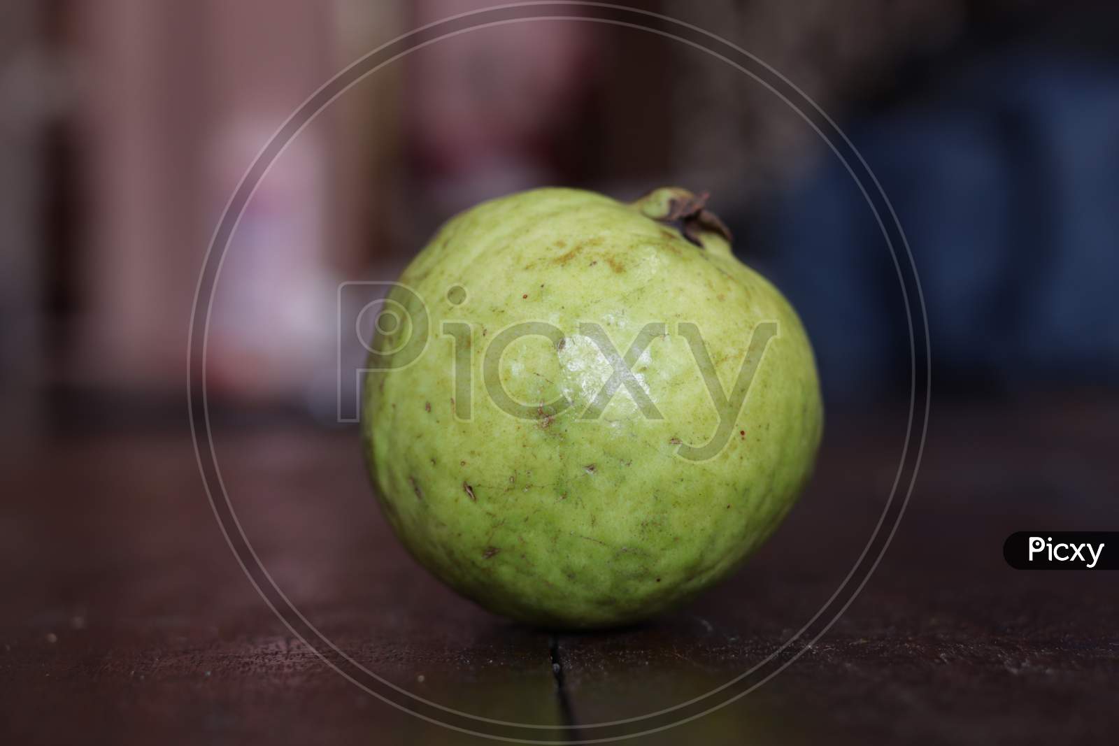 Green Fresh Guava Fruit On Table Closeup