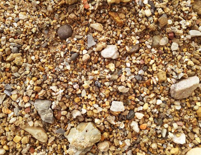 Small river stones or pebbles of various colors. colorful gravel background