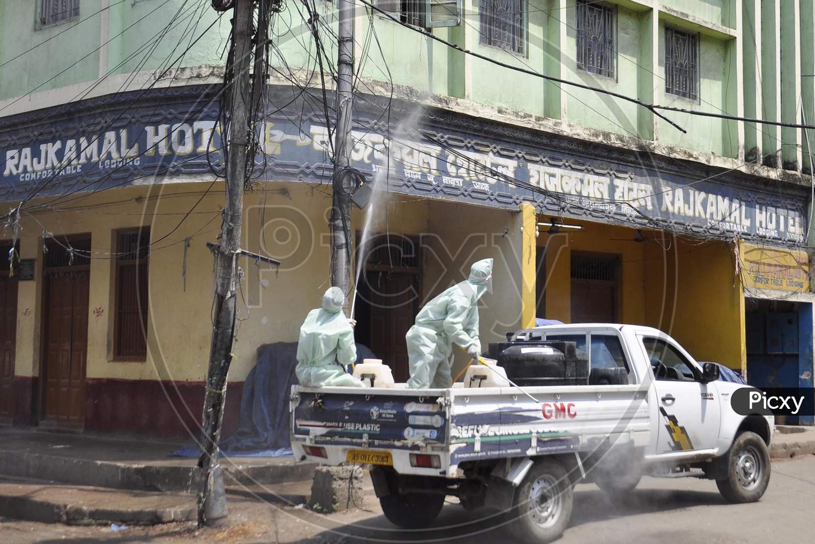 Municipal Workers Sanitize A Locality At Fancy Bazar Area After Reports Of A Coronavirus Positive Patient  During Nationwide Lockdown Amidst Coronavirus Or COVID-19 Pandemic  In Guwahati, Tuesday, May 12, 2020.