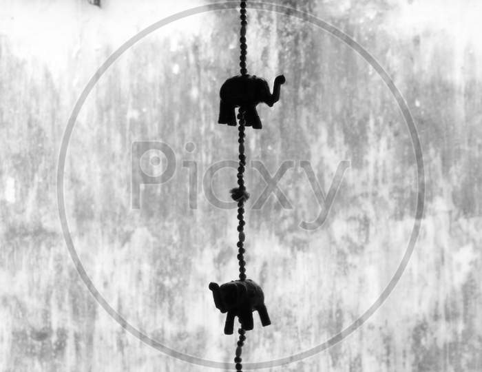 Silhouette of Hangings With Elephant Models