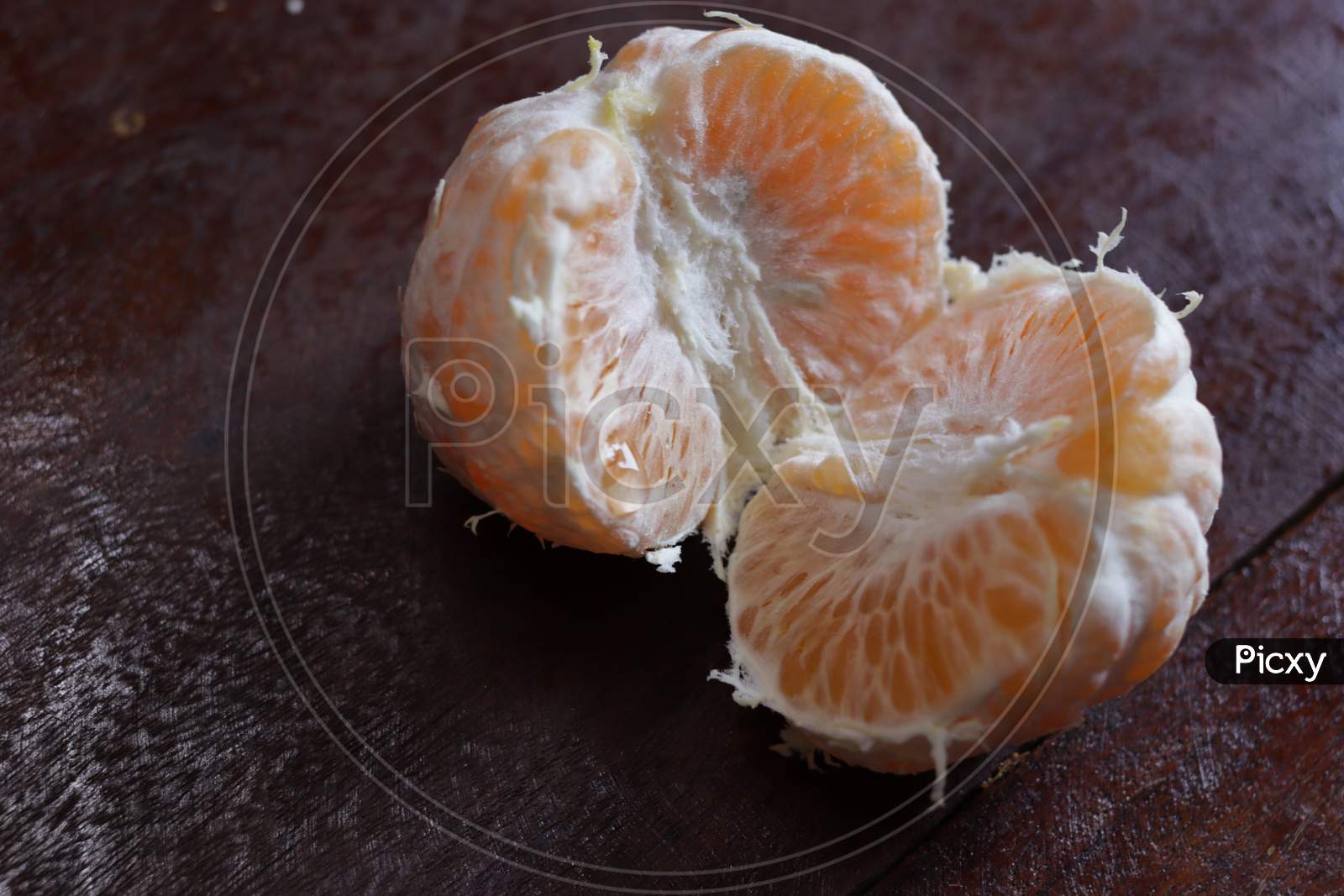 Peeled Orange Fruit Closeup On Wooden Background
