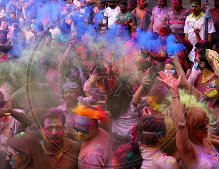 Foreign tourist smeared in colour powder celebrates the Holi, the spring festival of colours in pushkar, Rajasthan, India on 10 March 2020.