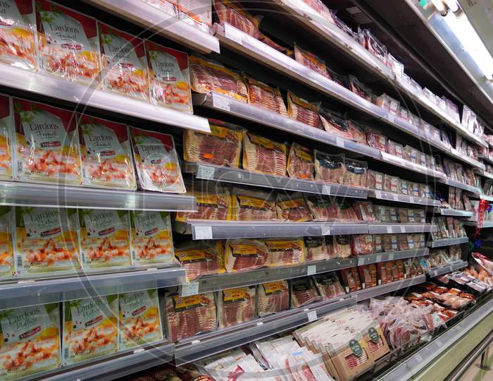 Meat, Supermarket, Butcher. Packets Of Meat At The Supermarket. Meat Aisle In Supermarket. Packaged Meats In Supermarket Refrigerated Section. Bacon, Turkey, Chicken, Steak.