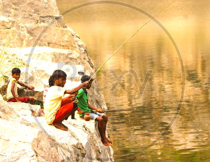 Tribal children fishing