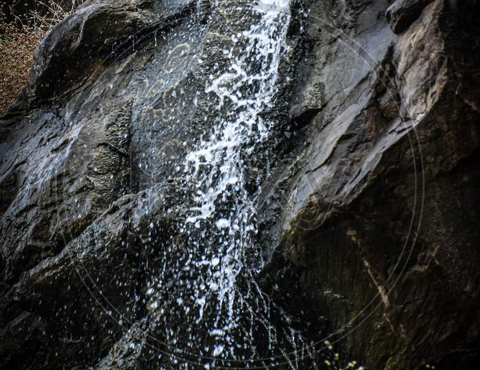 Falling of water from rocks