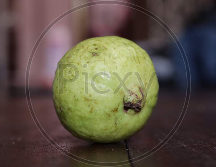 Green Fresh Guava Fruit On Table Closeup