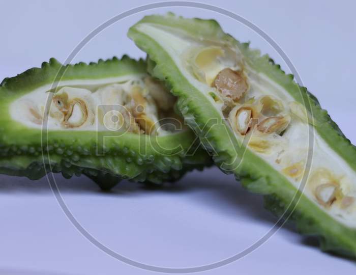 Sliced Green Bitter Gourd , Healthy vegetable on Isolated White background