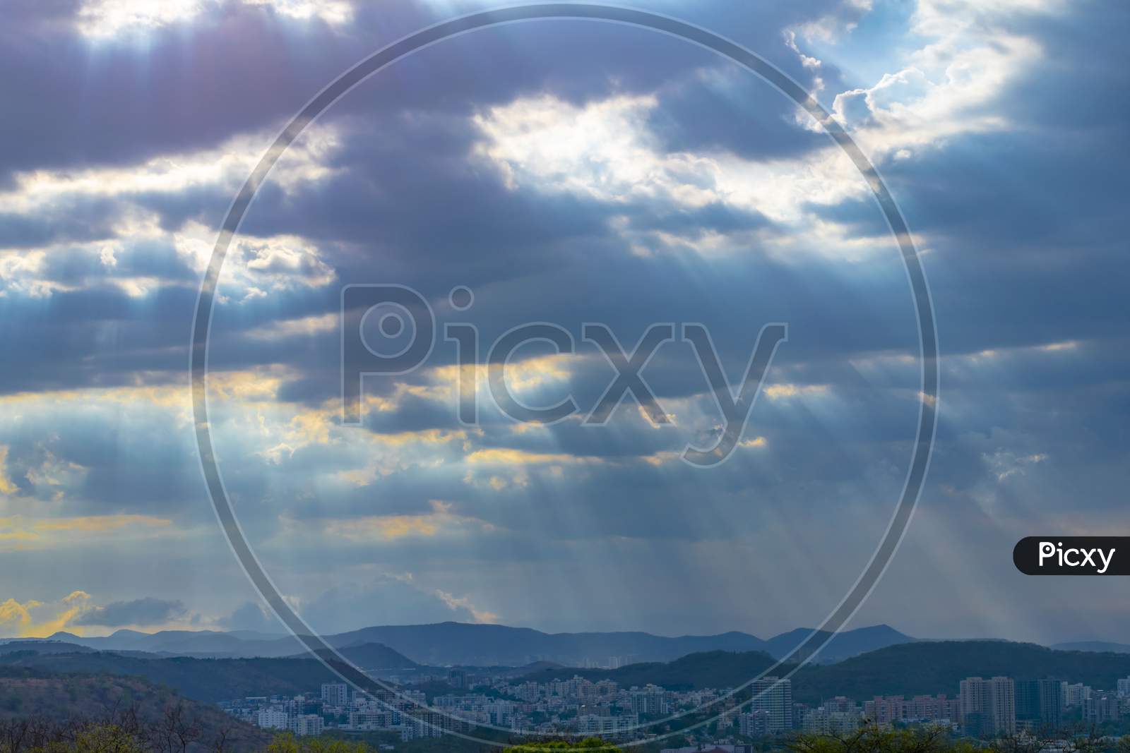 Cityscape With Sunrays Coming From Cloud Shot In Pune,India