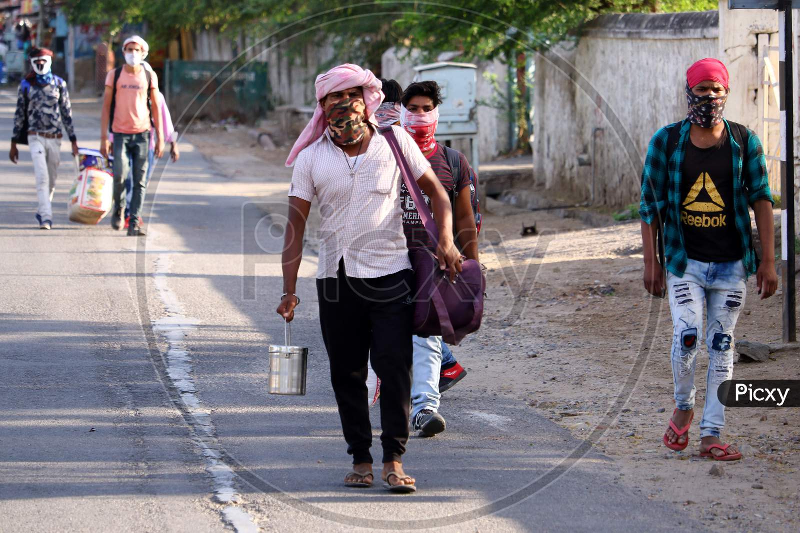 Migrant workers walks along a road as they leave working place for their homes during a government-imposed nationwide lockdown as a preventive measure against the COVID-19 in Ajmer, Rajasthan, India on 06 May 2020.