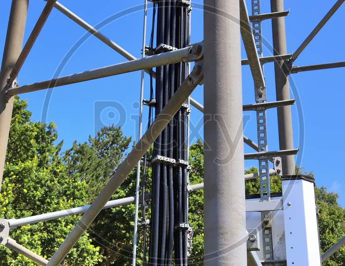 Big telecommunication antenna in a detailed close up view found on an agricultural field