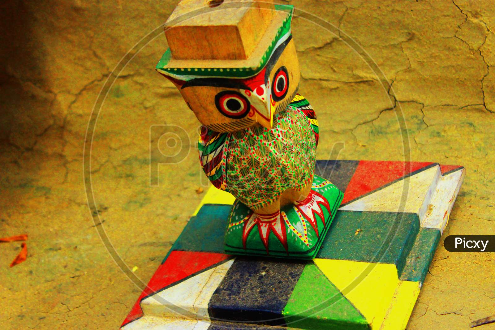 A solo wooden owl standing