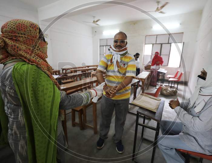 Teachers Sanitise Their Hands Before Marking Uttar Pradesh Board Copies During Nationwide Lockdown Amidst Coronavirus Or COVID-19 Pandemic  In Prayagraj, May 12, 2020