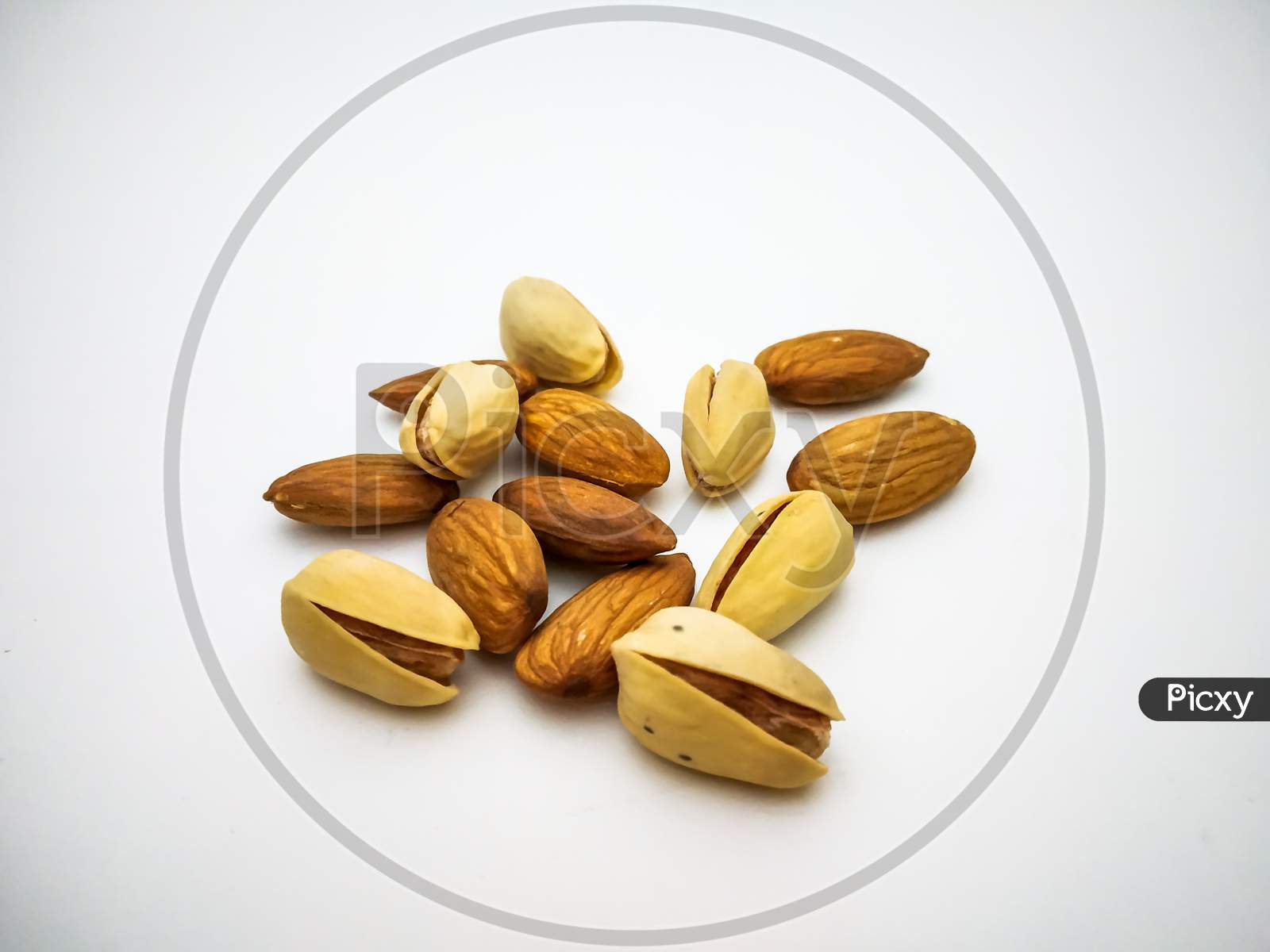 Dry Fruits Almonds And Pistachios Isolated With White Background