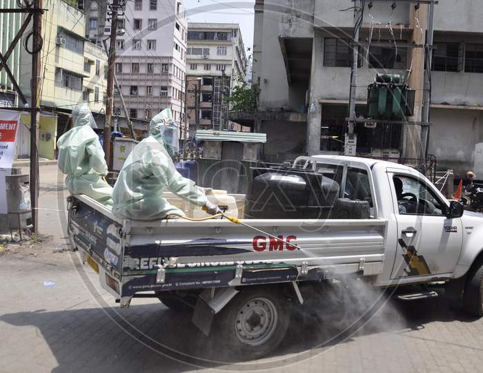 Municipal Workers Sanitize A Locality At Fancy Bazar Area After Reports A Coronavirus Positive Patient  During Nationwide Lockdown Amidst Coronavirus Or COVID-19 Pandemic  In Guwahati, Tuesday, May 12, 2020.