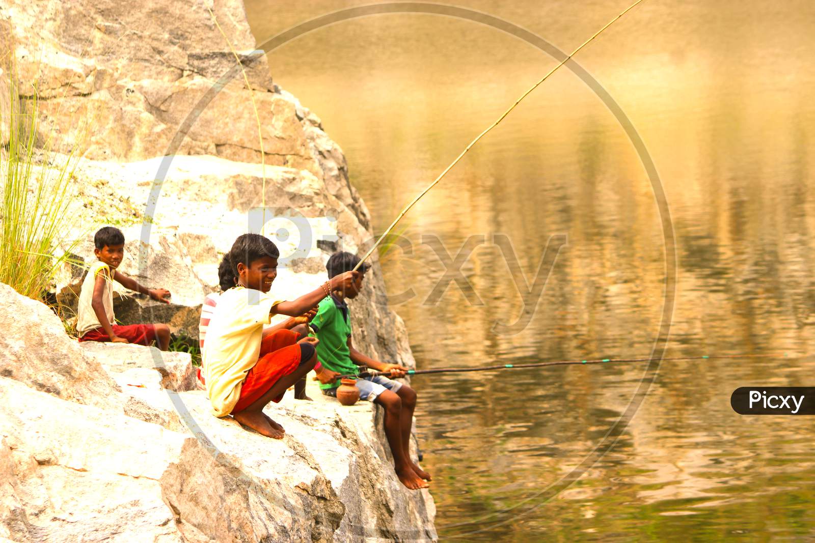Tribal children fishing