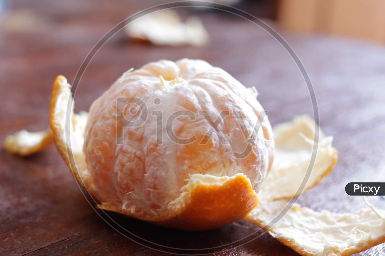 Peeled Orange Fruit Closeup On Wooden Background