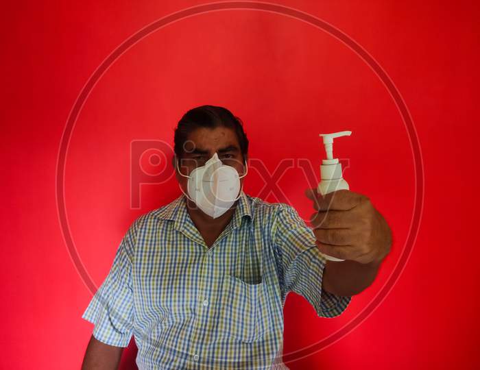 A Old Man Wearing Face Mask & Suggest To Wash Your Hand With Sanitizer For Corona Virus Protection In Covid-19