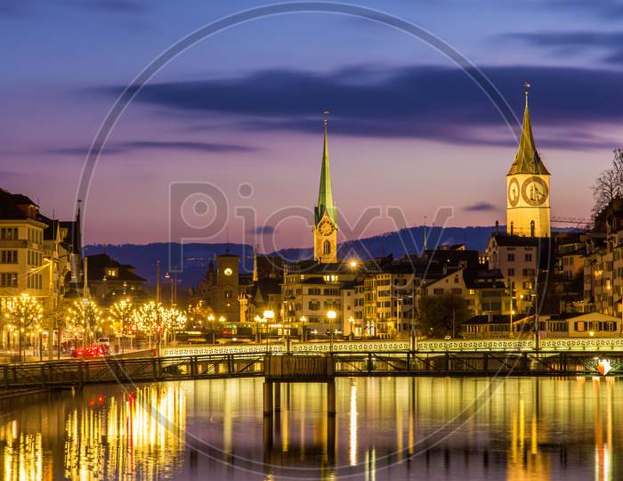 Zurich On Banks Of Limmat River On A Winter Evening
