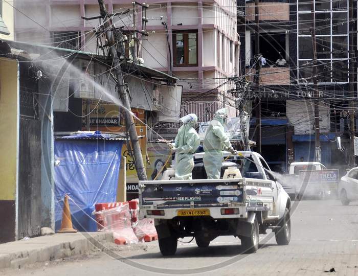 Municipal Workers Sanitize A Locality At Fancy Bazar Area After Reports Of A Coronavirus Positive Patient  During Nationwide Lockdown Amidst Coronavirus Or COVID-19 Pandemic  In Guwahati, Tuesday, May 12, 2020.