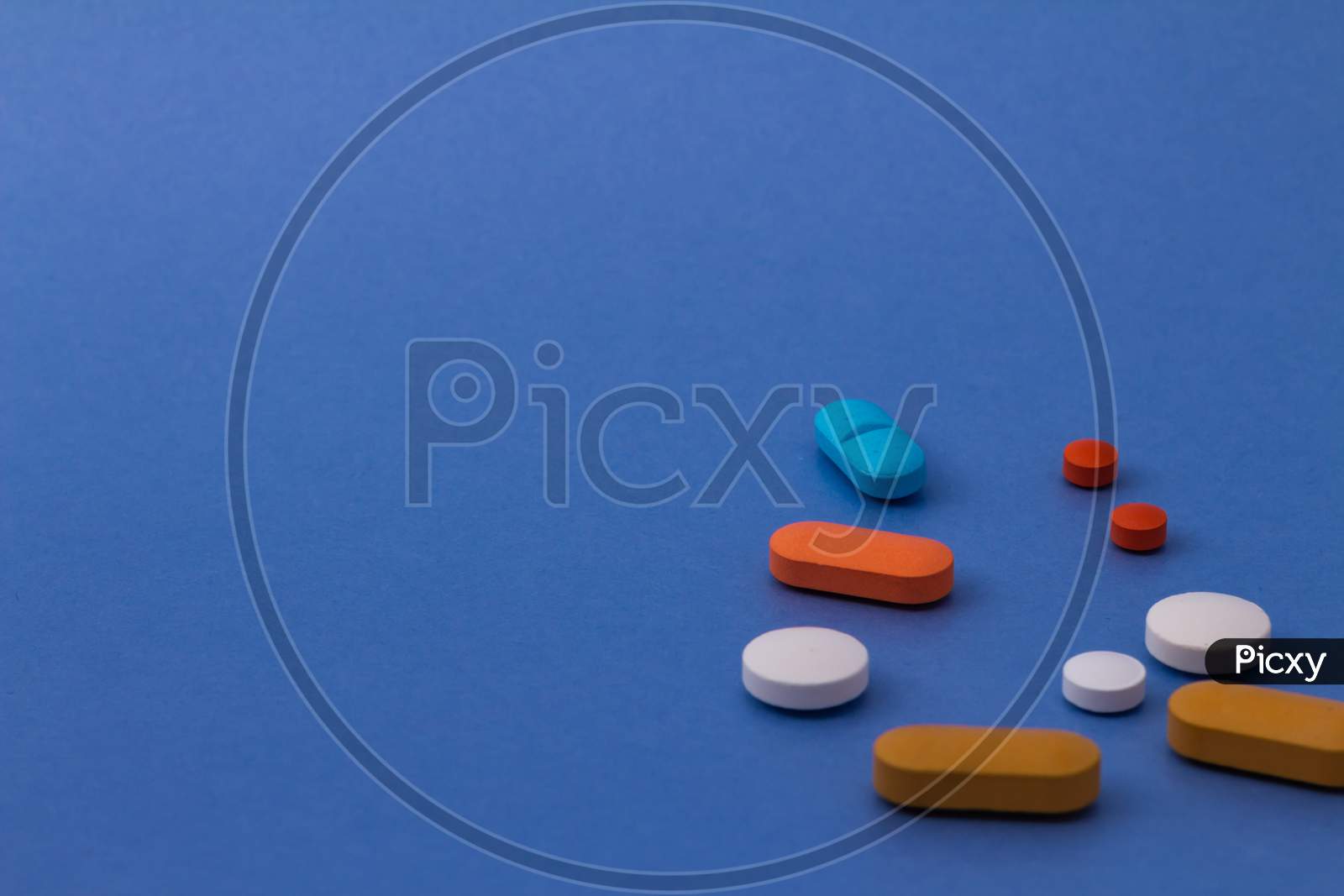 Pills Of Colors On Neutral Background. Legal Drugs From The Pharmaceutical Industry. Medicines For Use In Humans.