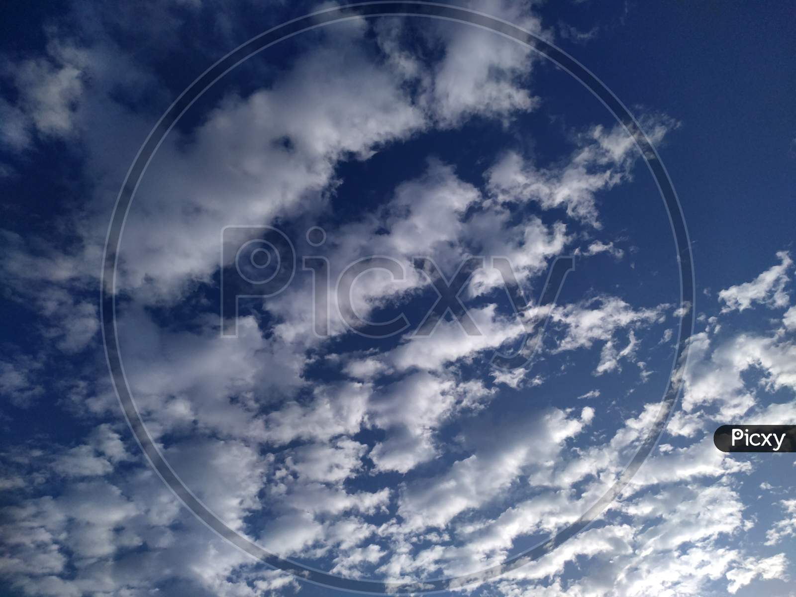 Blue sky background and white clouds soft focus, and copy space