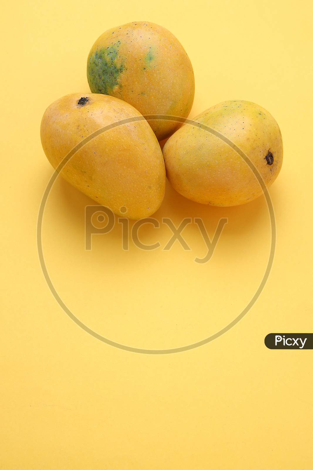 Yellow Mango Isolated On Yellow Background
