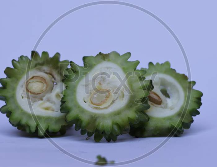 Sliced Green Bitter Gourd , Healthy vegetable on Isolated White background