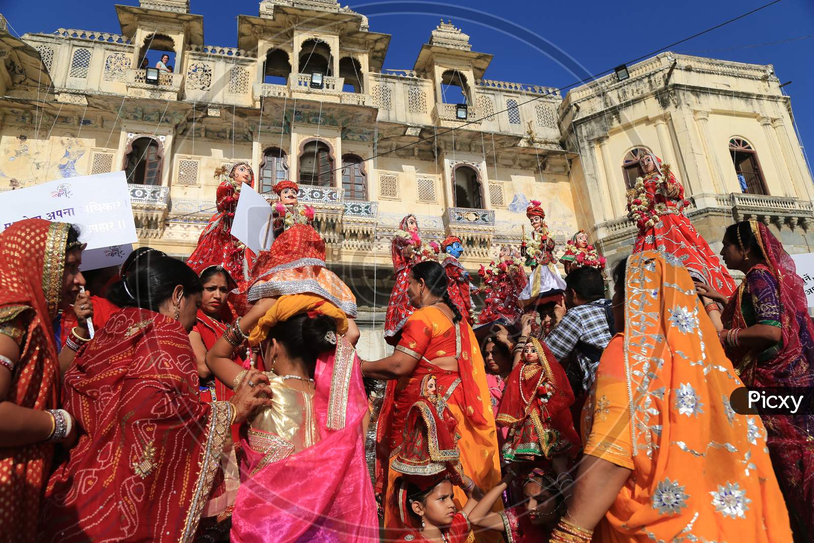 Indian married women take part in the Gangaur festival in Udaipur, in Rajasthan state, on April 8, 2019. During the Gangaur festival, married women worship the Hindu goddess Gauri, consort of the deity Shiva.