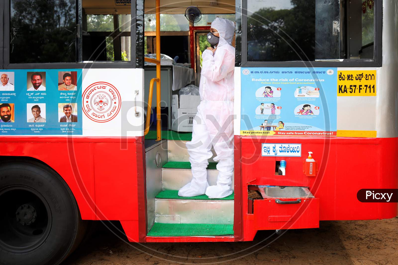 A doctor waits for personnel to test for covid-19 in a repurposed bus during a health screening camp for the police forces in Bangalore, India.