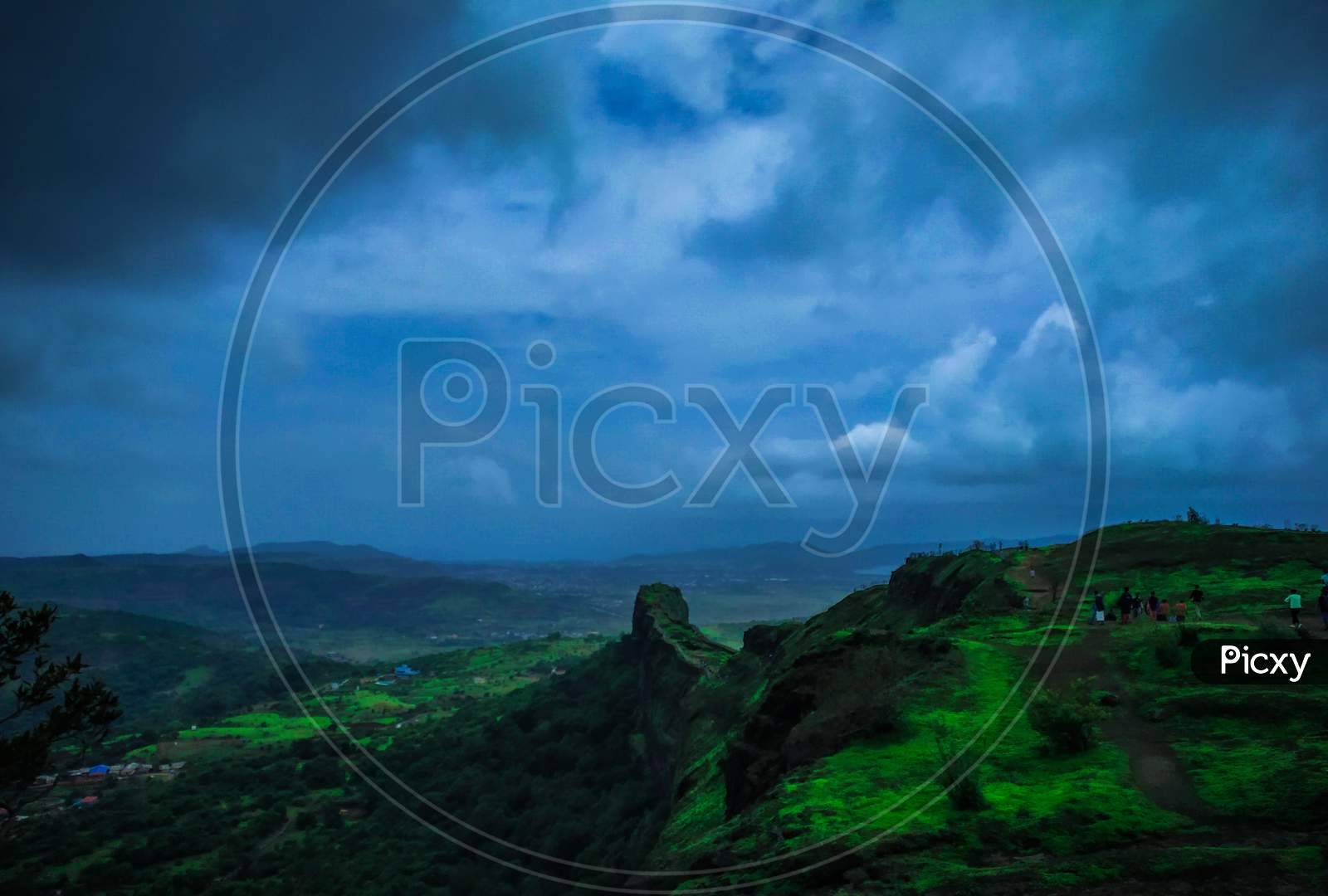 A Wide Angled View Of Lohagad, Pune, Maharashtra With Blue Sky And Clouds In Background And Different Colors