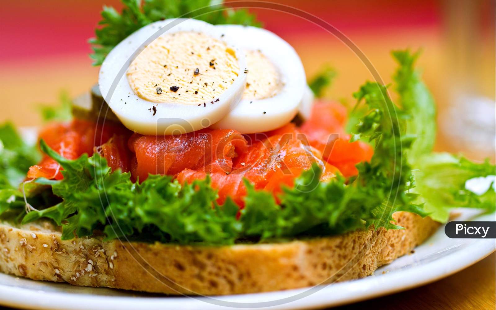 Boiled Egg with brown bread and vegetables