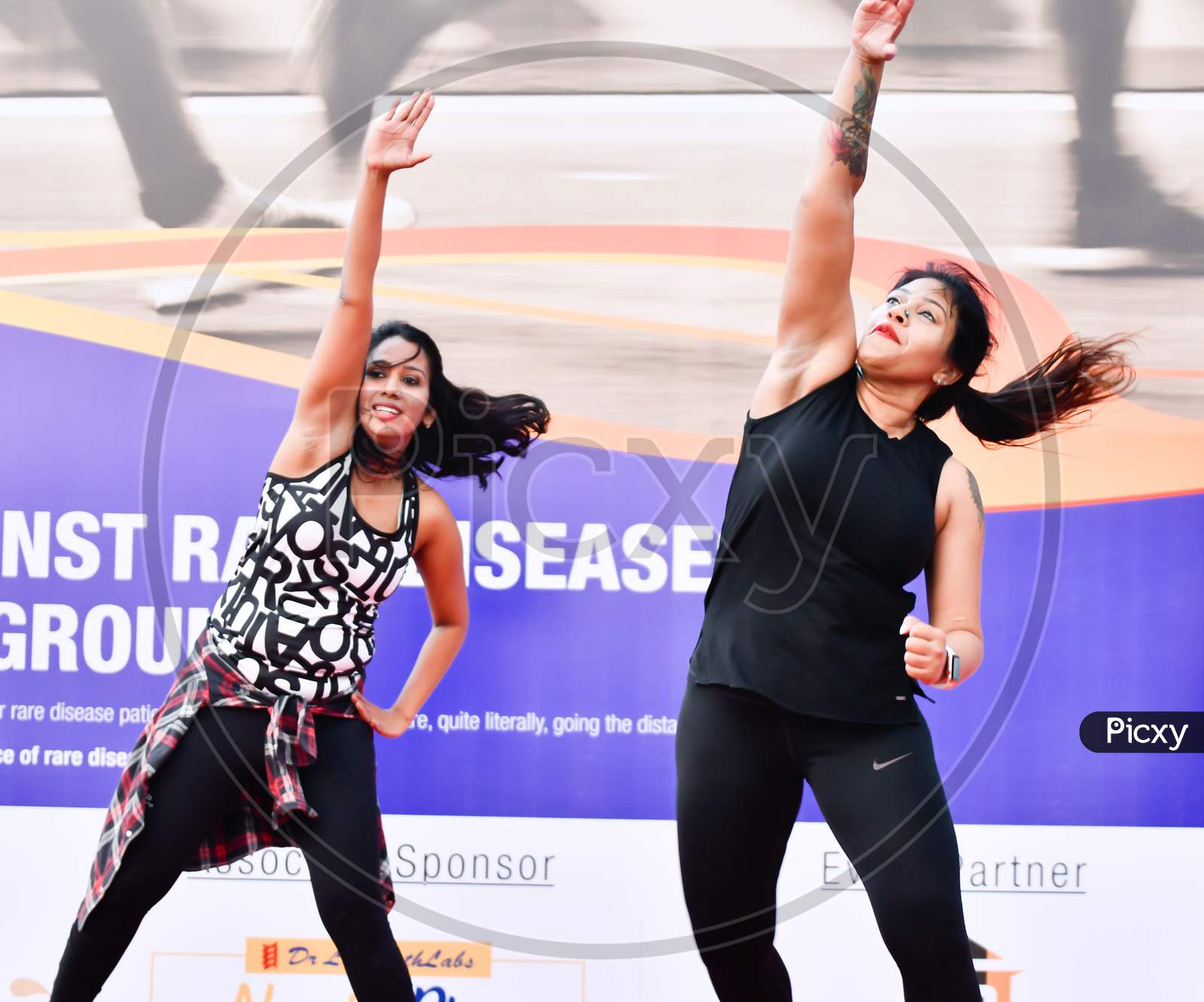 Zumba Dancers Performs Zumba During Marathon Warmup Session,Corporate yoga pose