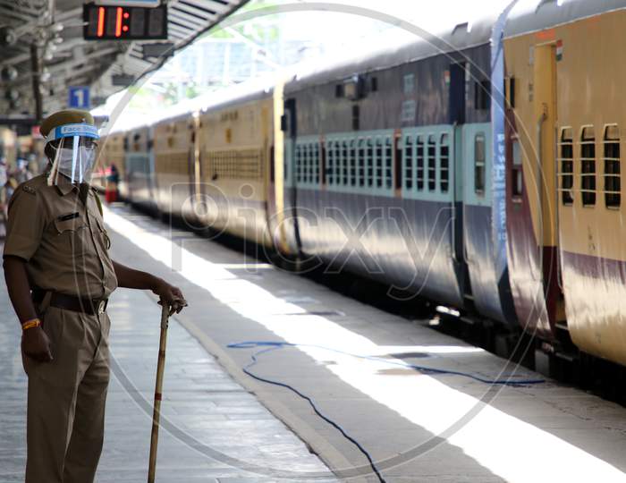  A Security Personnel Stands Near A Special Train Which Will Be On-Boarded By Migrants To Bihar State From Ajmer Railway Station During A Government-Imposed Nationwide Lockdown As A Preventive Measure Against The Covid-19 Or Coronavirus, In Ajmer on May 13, 2020.