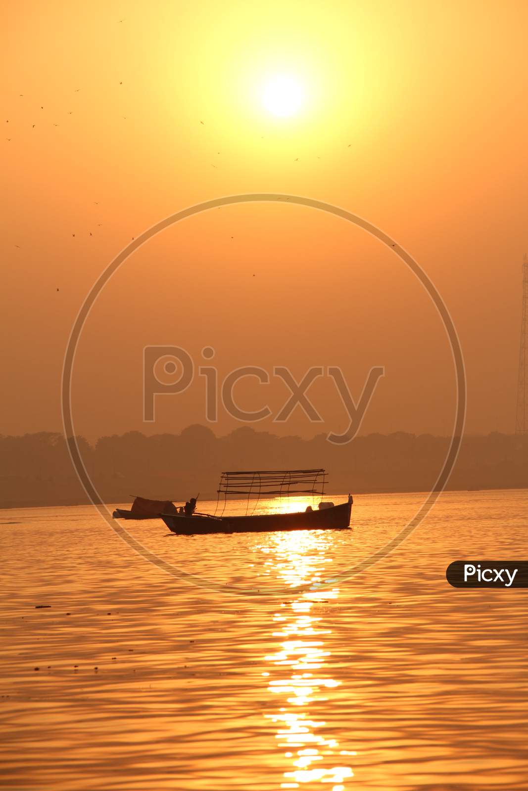 Silhouette of  Boats In  Sangam, the confluence of the Ganges, Yamuna and Saraswati rivers, Prayagraj, previously known as Allahabad, India.