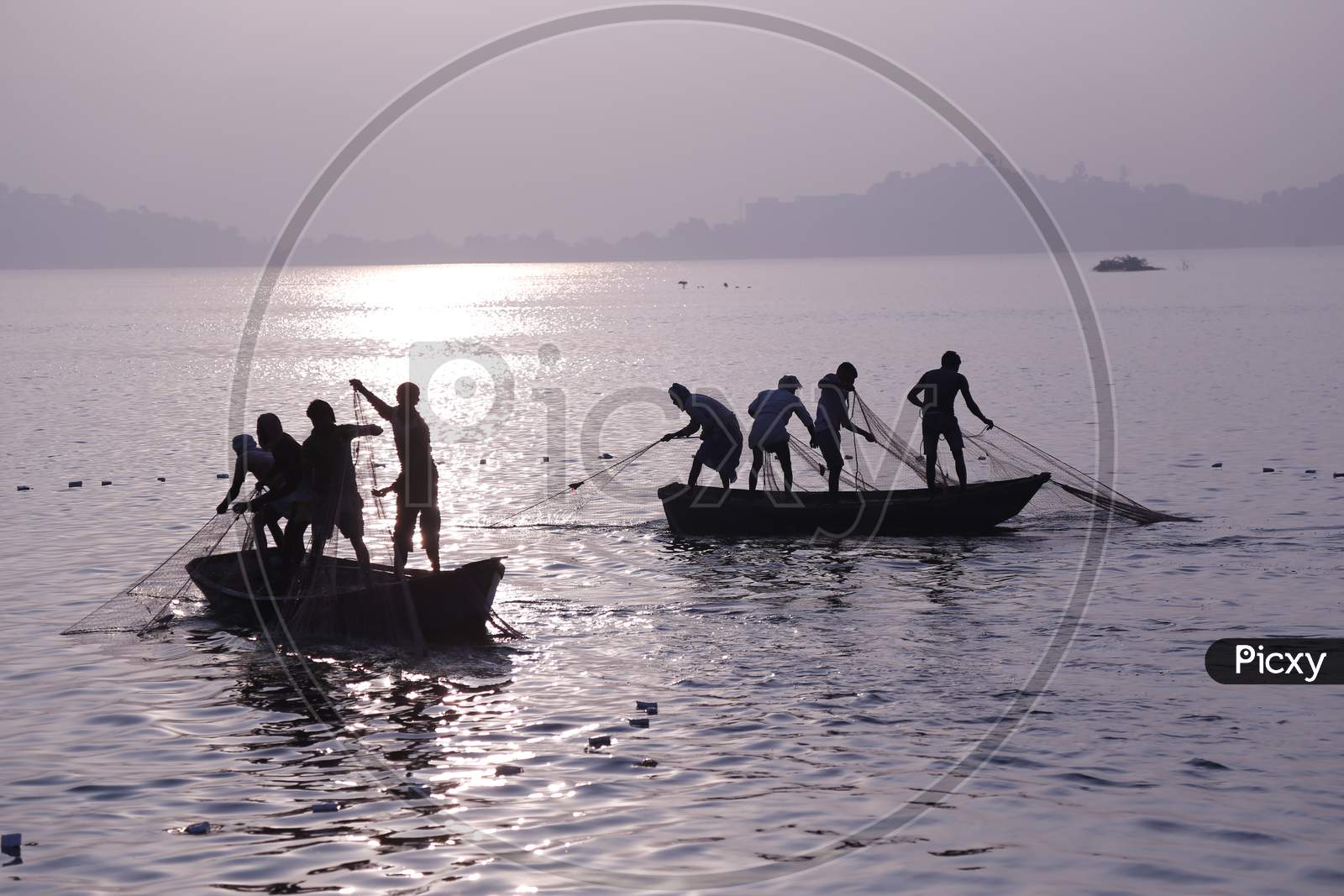 Indian Fishermen Catch Fishes In Anasagar Lake In Ajmer, Rajasthan, India.