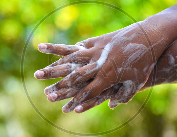 Washing hands with soap. Cleanliness and body care concept.