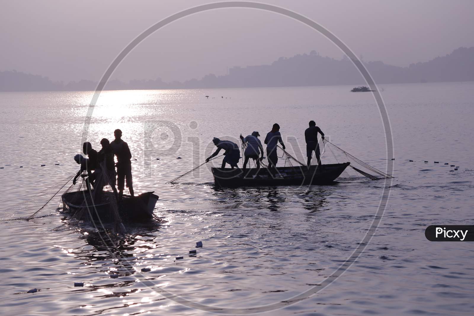 Indian Fishermen Catch Fishes In Anasagar Lake In Ajmer, Rajasthan, India.