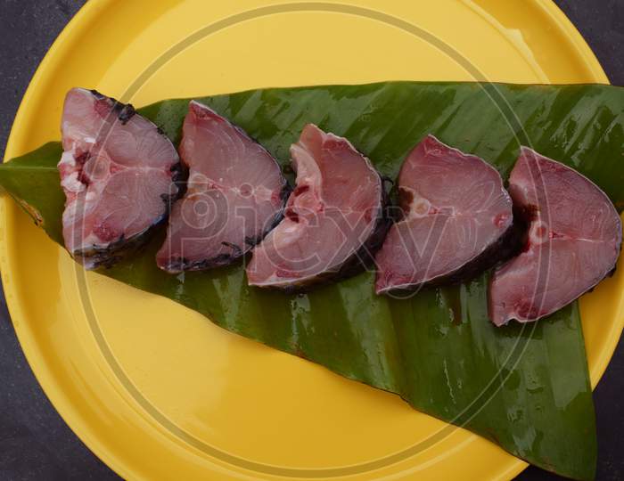 Raw fish Steaks of Rohu fish Labeo Rohita over banana leaf