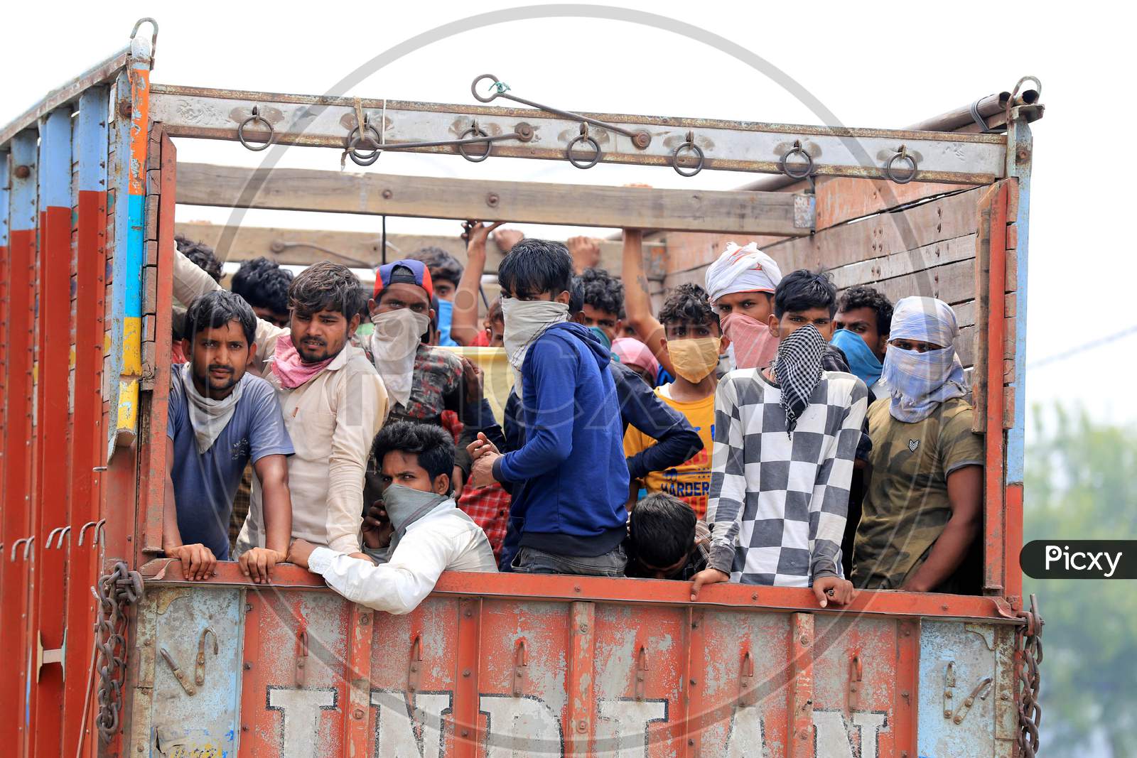 Migrant Workers Board A Truck To Reach Their Native Places During Nationwide Lockdown Amidst Coronavirus Or Covid-19 Pandemic In Prayagraj