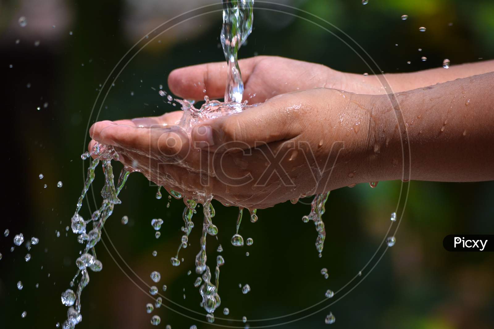 Hands with water splash