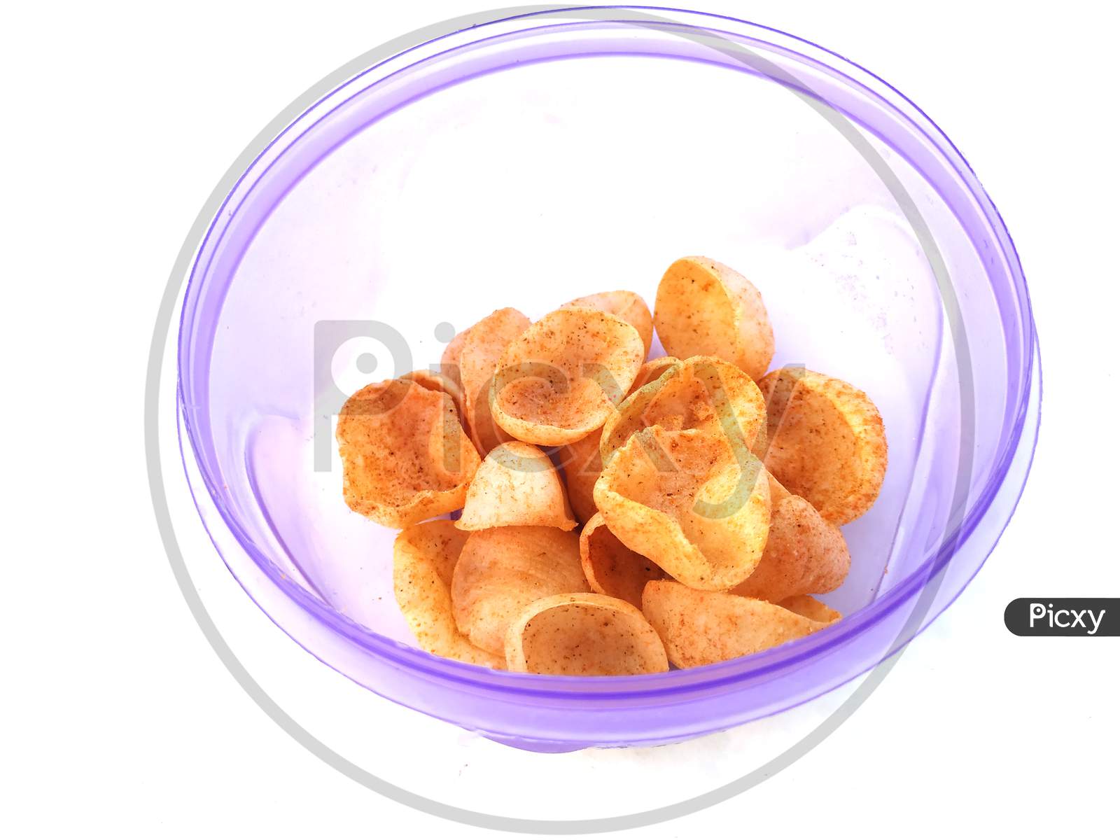 some yellow eatable food put in blue plastic bowl isolated on white background
