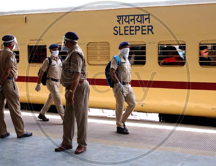 Security Personnel Stand Near A Special Train Which Will Be On-Boarded By Migrants To Bihar State From Ajmer Railway Station During A Government-Imposed Nationwide Lockdown As A Preventive Measure Against The Covid-19 Or Coronavirus, In Ajmer On May 13, 2020.