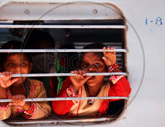 Stranded migrants board a special train to Bihar State from Ajmer railway station during a government-imposed nationwide lockdown as a preventive measure against the COVID-19 coronavirus, in Ajmer on May 13, 2020.