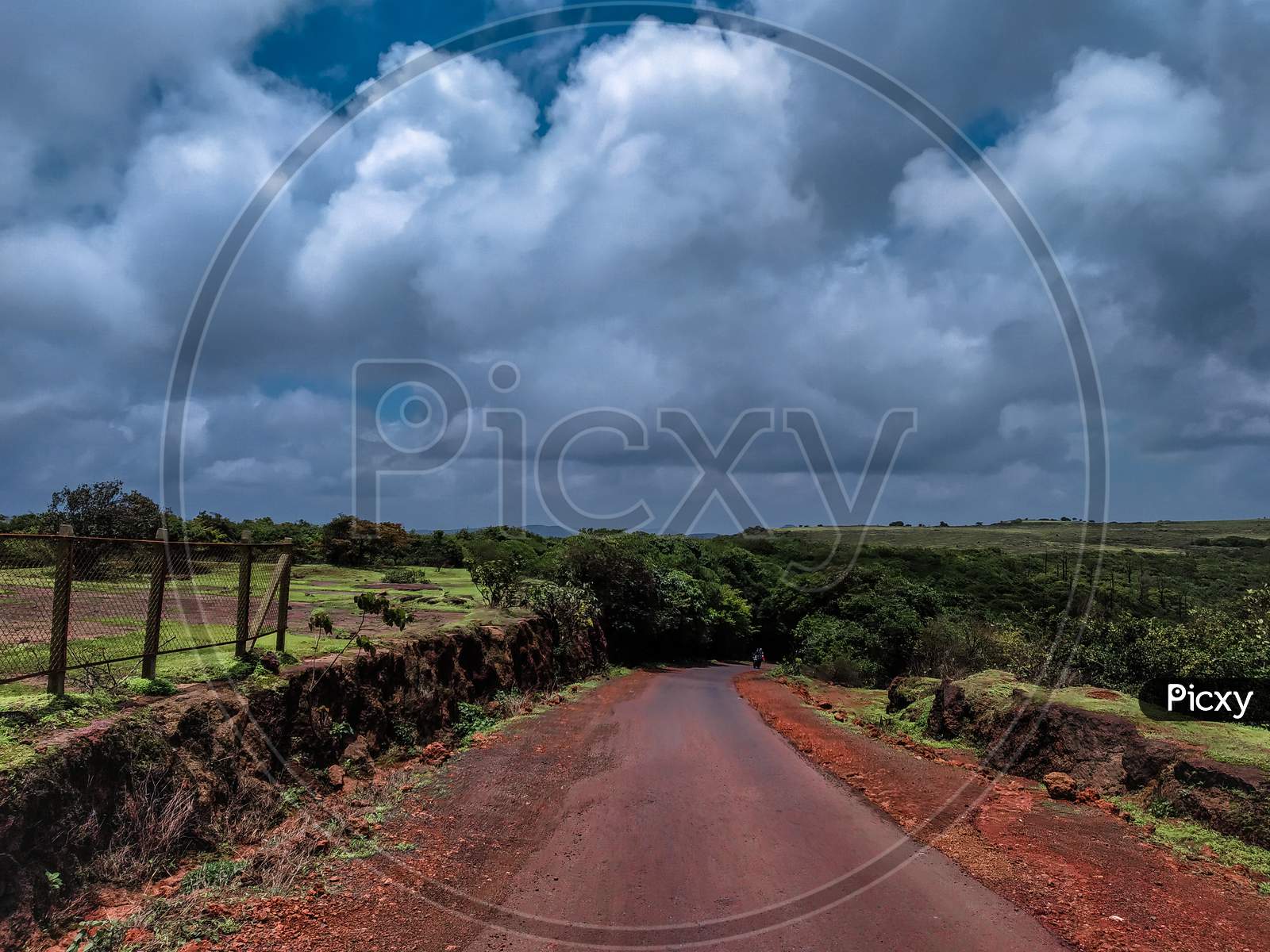 Landscape Of Road With A Blue Sky And White Clouds