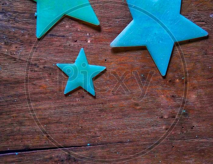 Plastic Star pictures wooden background