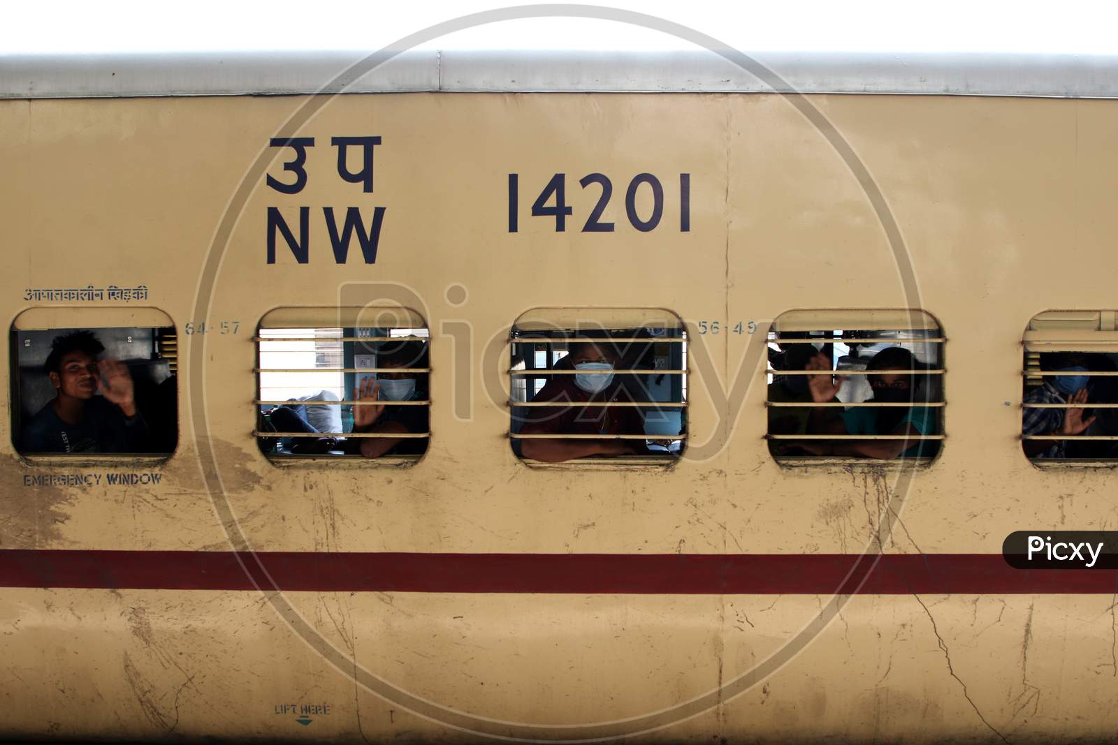 A Stranded migrant boards a special train to Bihar State from Ajmer railway station during a government-imposed nationwide lockdown as a preventive measure against the COVID-19 coronavirus, in Ajmer on May 13, 2020.
