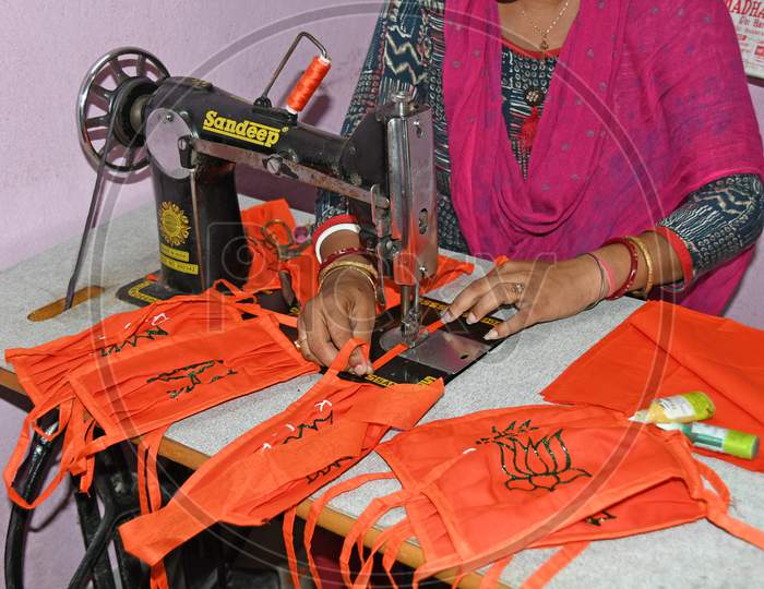 A local BJP leader in Burdwan Town is making a face mask with the symbol of Bharatiya Janata Party to prevent Novel Coronavirus (COVID-19)