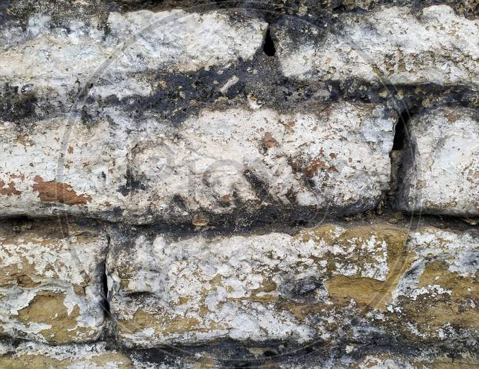 Old Wall with Moldy Peeling White Painting from Humidity. Cracked White Wall as Rusty Concrete Weathered Wall Grunge Background