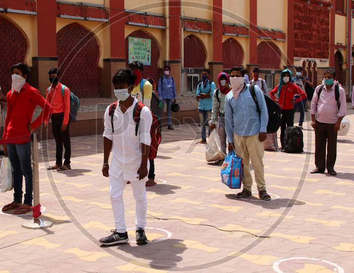 Stranded migrants wait to board a special train to Bihar State from Ajmer railway station during a government-imposed nationwide lockdown as a preventive measure against the COVID-19 coronavirus, in Ajmer on May 13, 2020.