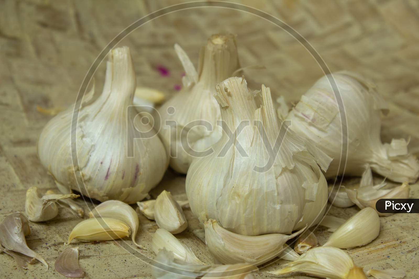 View Of Broken Down Garlic Pieces And The Whole Ones. Garlic Helps Build Immunity Against Cold And Flu.